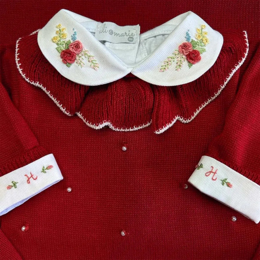 body anne branco de manga longa com gola redonda bordada com flores em tons de vermelho e rosa