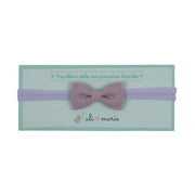 faixa de cabelo lilás com laço simples em tecido, delicada e confortável para bebês