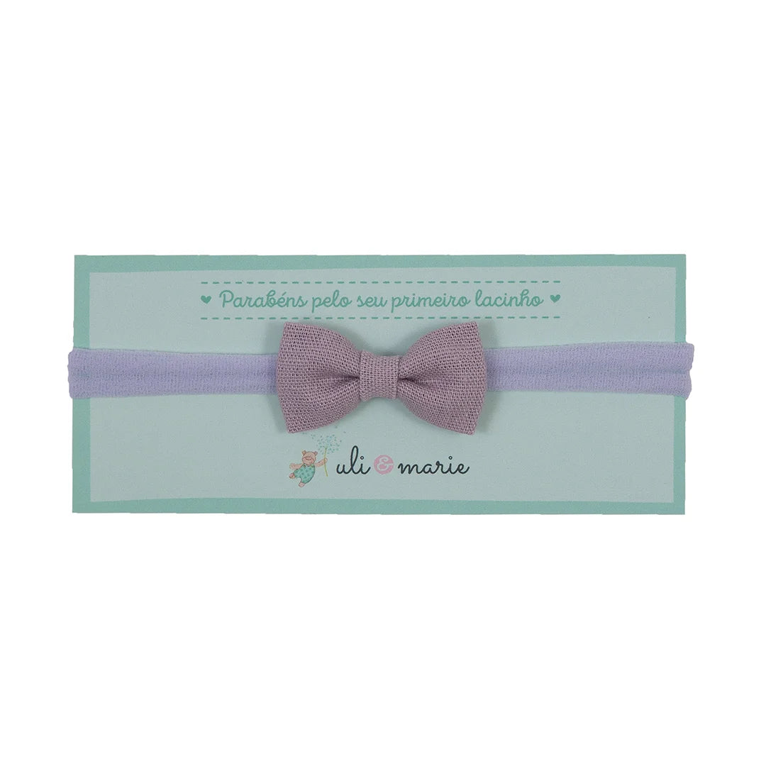 faixa de cabelo lilás com laço simples em tecido, delicada e confortável para bebês