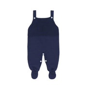 jardineira bambu azul marinho de tricô com diferentes texturas e botões brancos no fechamento frontal