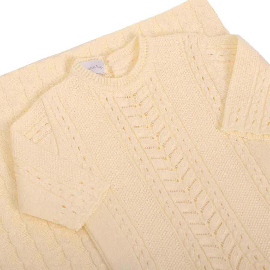 macacão firenze amarelo bebê de tricot com manga longa e detalhes de trama em zig zag