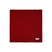 manta básica vermelha em tricô com ponto simples em toda a peça e barra detalhada com canelado fino