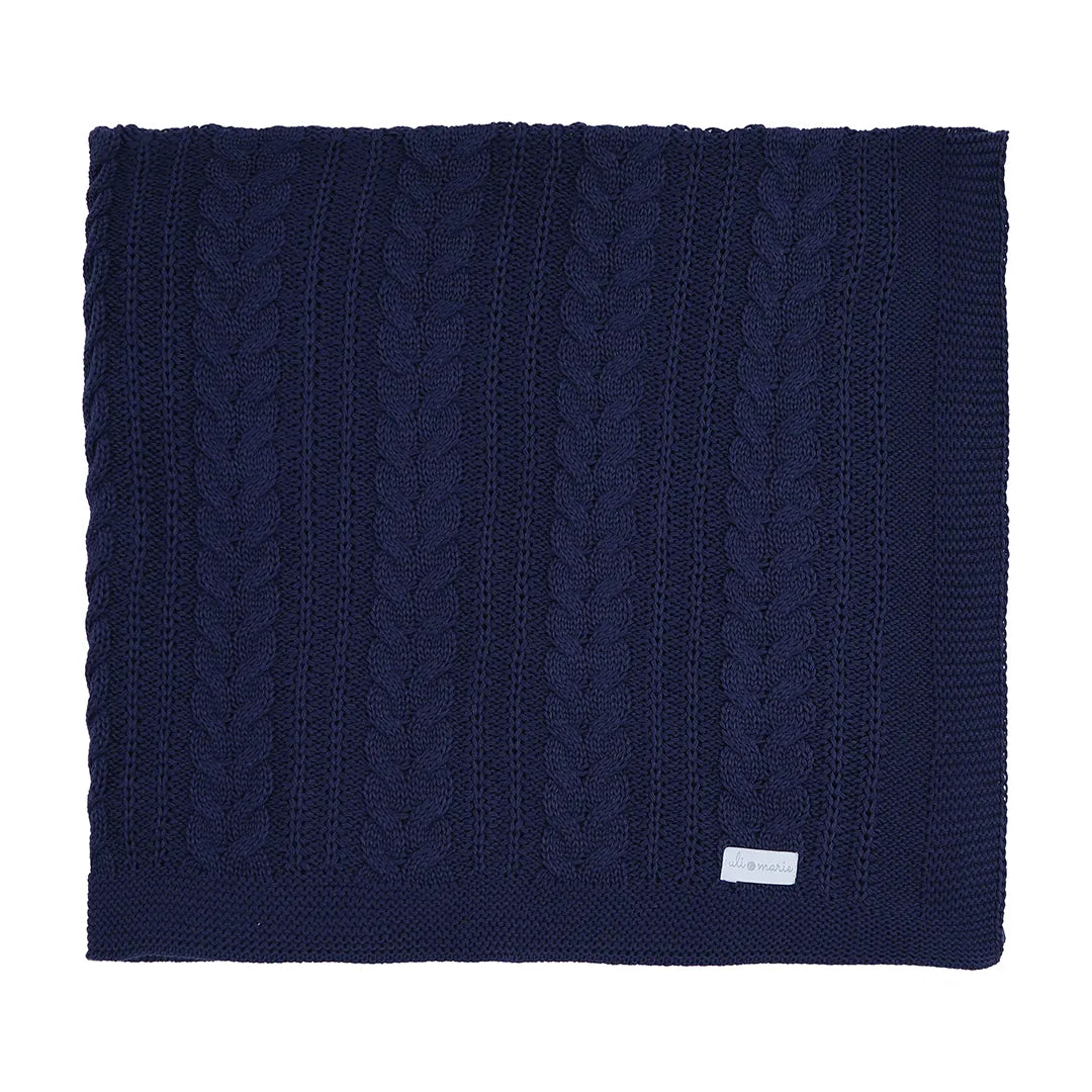 manta sorrento azul marinho em tricô com padrão trançado e acabamento em barra canelada