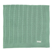 manta uli verde cideira em tricô com padronagem de tranças verticais e acabamento em barra canelada