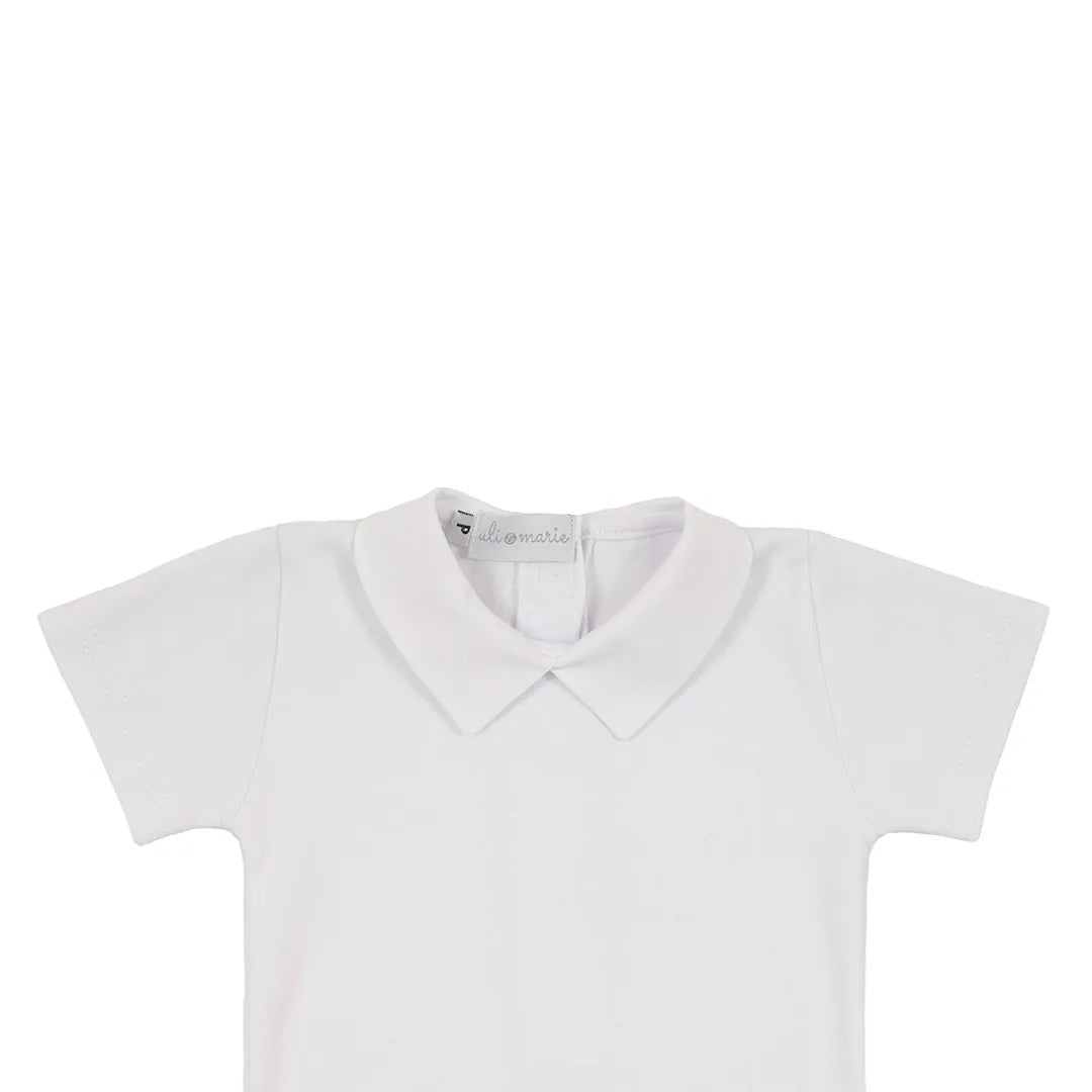 romper classic azul marinho de tricot trançado e curto, com botões decorativos e body branco de gola polo