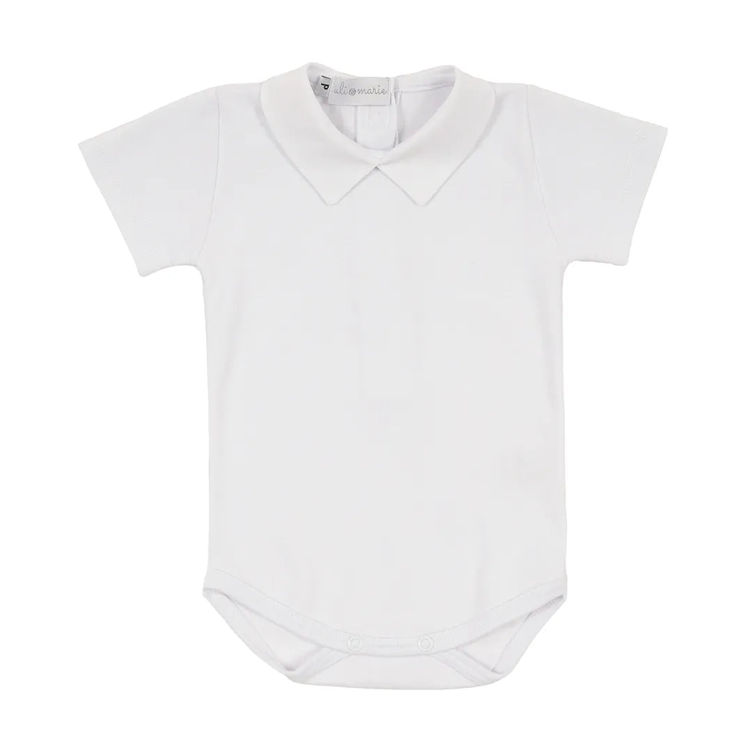 romper classic azul marinho de tricot trançado e curto, com botões decorativos e body branco de gola polo